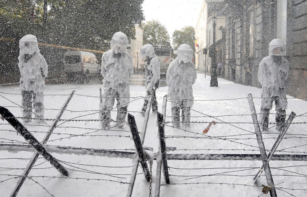 Belgian riot police are covered with foam sprayed by Belgian firefighters during a protest for better work conditions in central Brussels. Yves Herman is a Reuters staffer currently based in Belgium. Check out more of his work <a href="http://www.americanphotomag.com/photo-gallery/2012/12/photojournalism-week-december-14?page=1">here</a>.