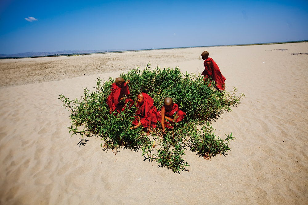 Burmese monks on a beach near Bagan