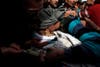 A man mourns at the body of a member of the Free Syrian Army who died during clashes, at Bustan al Qasr cemetery in Aleppo, Syria. Hamid Khatib is a photojournalist stringing for Reuters in Syria.