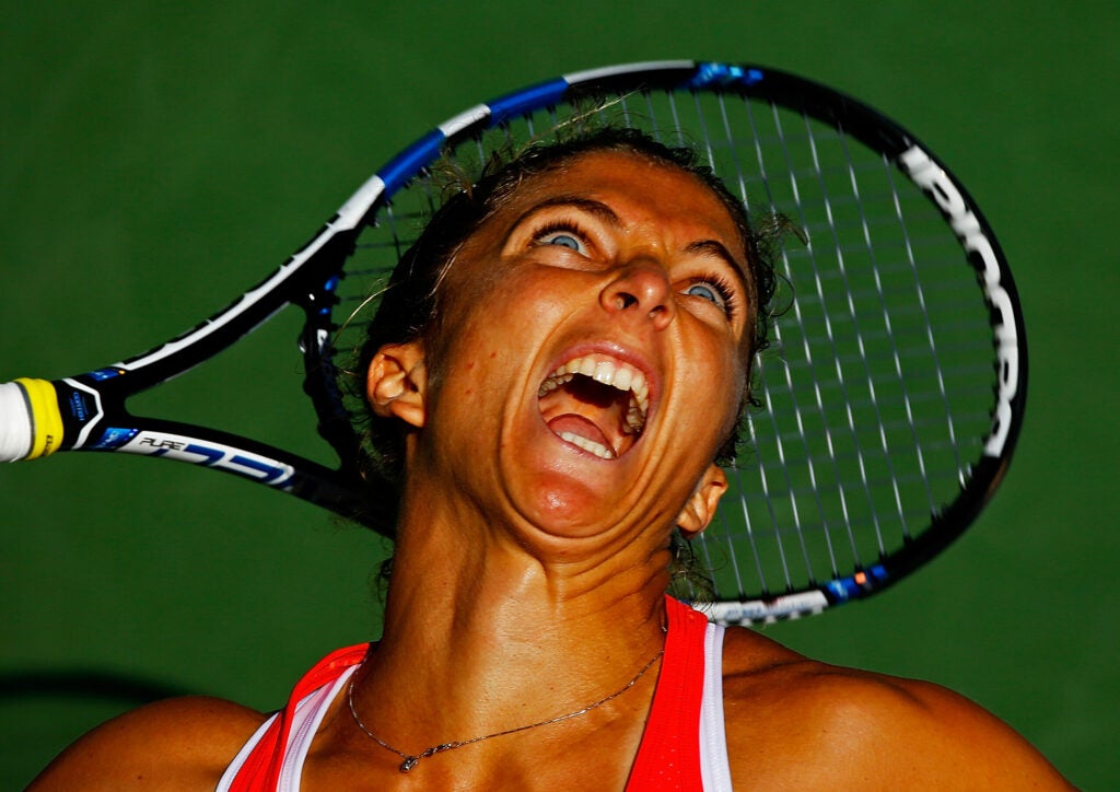 Sara Errani of Italy serves to Samantha Stosur of Australia during their Women's Singles Third Round match on Day Six of the 2015 US Open at the USTA Billie Jean King National Tennis Center on September 5, 2015 in the Flushing neighborhood of the Queens borough of New York City.