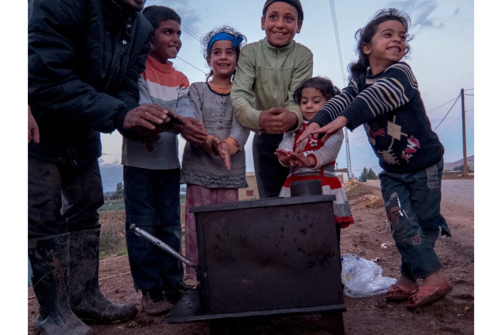 "Real warmth is to be with who you love, anywhere. This is what I learned from this scene of a family. The father is trying to fix the stove (which needs wood) and the kids are trying to have fun around their father. I also identified a new actress for my theater class (it's the girl on the right)."