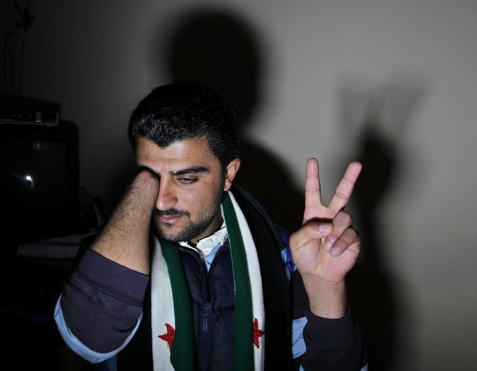 Reuters photographer Ali Jarekji captured this powerful image of Zaher Al Hariri, a Syrian citizen, speaking to the media, after an ordeal in which Syrian security forces chopped off his right hand at a local hospital. Al Hariri had originally gone to the hospital to address a bullet wound he sustained during a pro-democracy rally (fired by Syrian security forces).