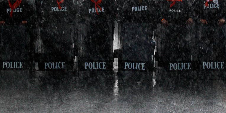 Photo of the Day: Thai Police Take Position in Torrential Downpours