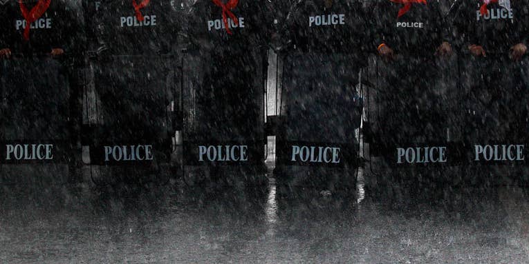 Photo of the Day: Thai Police Take Position in Torrential Downpours Photo of the Day: Thai Police Take Position in Torrential Downpours