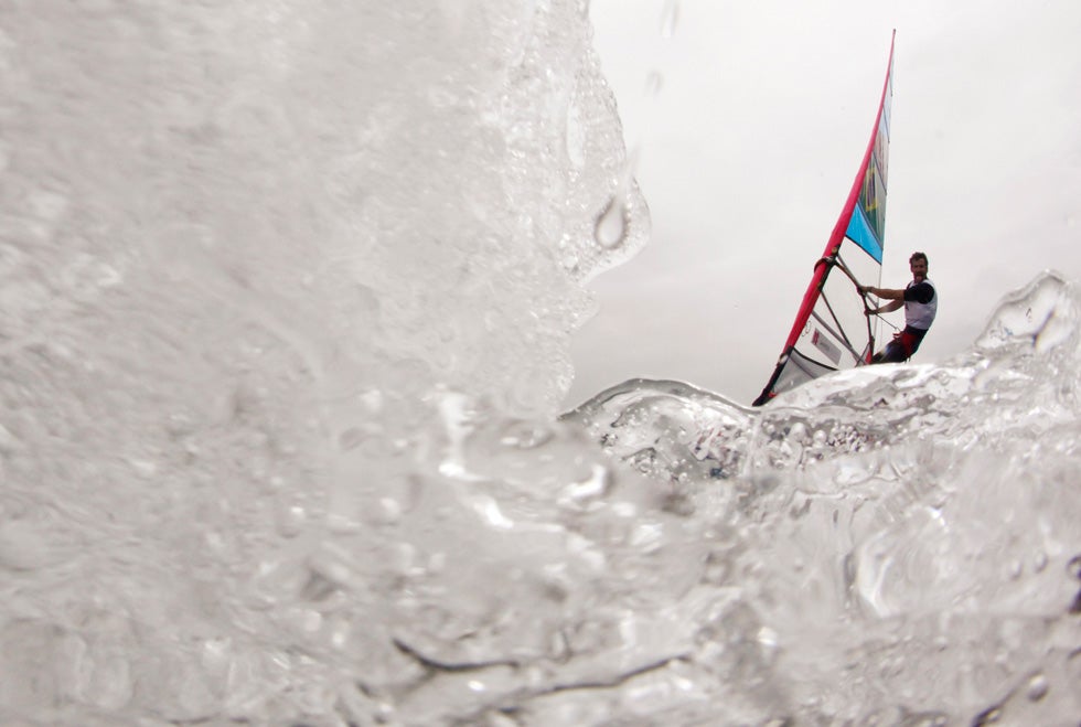 Brazil's Ricardo Santos sails before the first race of the men's RS-X sailing class at the London 2012 Olympic Games. Pascal Lauener is a Reuters photographer covering sailing events specifically for the 2012 Games. Read more about the challenges of shooting such a sport on the <a href="http://blogs.reuters.com/pascallauener/">Reuters blog</a>.