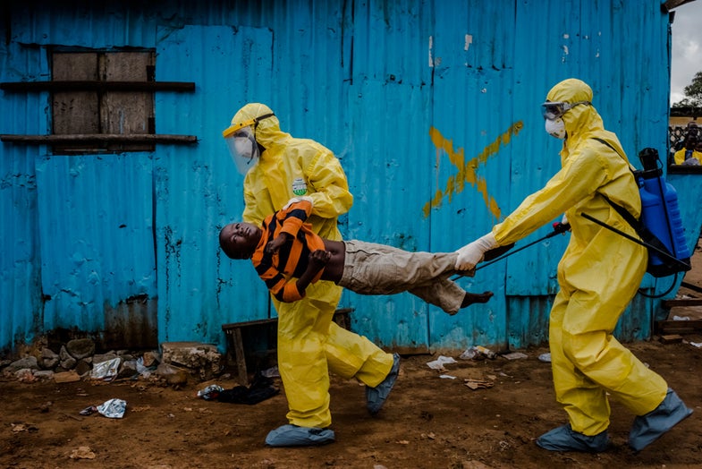 5. Sept. 5, 2014. James Dorbor, 8, suspected of being infected with Ebola, is carried by medical staff to an Ebola treatment center in Monrovia. The boy, who was brought in by his father, lay outside the center for at least six hours before being seen.