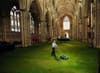 1500 square feet of grass, laid out in York Minster for the Queen’s Diamond Jubilee celebration dinner, is carefully manicured before guests arrive. John Giles is a Press Association Wire staff photographer based in England.