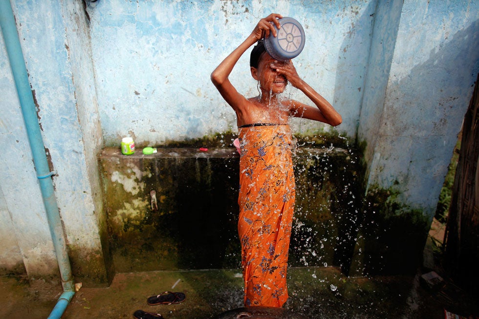 27 year-old HIV-positive Zinmar Nwe, whose husband died of AIDS, bathes at an HIV/AIDS hospice in Myanmar. Officials are currently seeking improved treatment for HIV and AIDS patients in the country, but many feel that massive health reform is needed before treatments will improve. Damir Sagolj is a Reuters staff photographer working in the region. He recently was awarded first prize in the <a href="http://blogs.reuters.com/photographers-blog/2012/02/10/damir-sagolj-wins-world-press-award/">World Press Photo Daily Life Singles category</a> for an image of Kim II-Sung hung on a wall in Pyongyang. Check out more of his work on the <a href="http://blogs.reuters.com/damir-sagolj/">Reuters blog</a>.