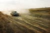 Newberry's shot of a vintage Valiant on a dusty road, from <em>Halfway to Midland.</em> "I come from a car culture," she says. "It's a huge symbol of what I consider the passing of time and this landscape that I happen to live in."