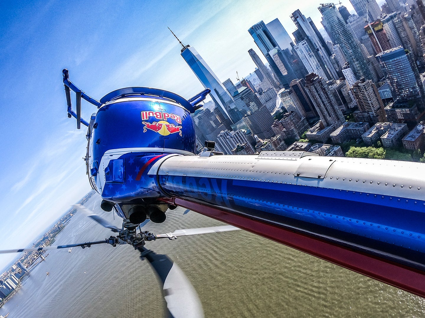 POV shot of red bull helicopter in the midst of one of its aerial maneuvers