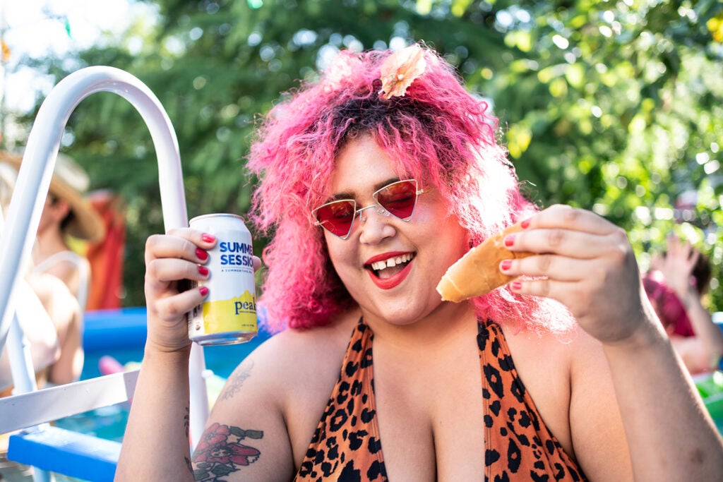 girl with pink hair and hotdog