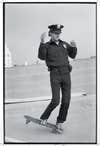 skateboarding policeman