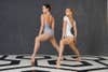 dancers on black and white geometrical floor