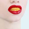 womans lips with red lipstick and yellow corn teeth
