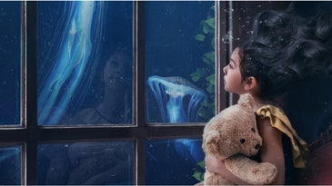 photo manipulation of little girl with floating hair with the ocean outside the window