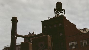 Watertower against a muted sky in New York.