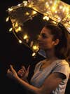 photo using fairy lights taped to umbrella as a light source