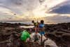 Kids fishing at sea shore