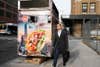 Pedestrian passing a food truck