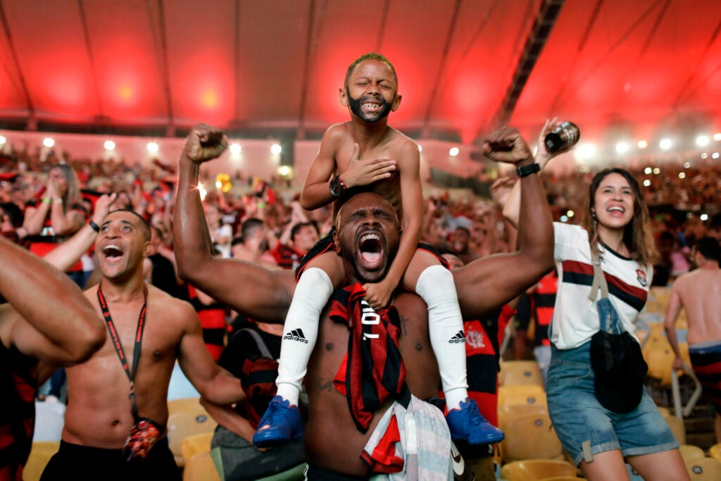 Fans of Brazilâs Flamengo football team cheer as Gabriel Barbosa scores a goal against defending champions River Plate of Argentina