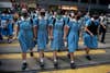 Students cross a road to school after participating in a human-chain rally, in Hong Kong, on 12 September 2019.