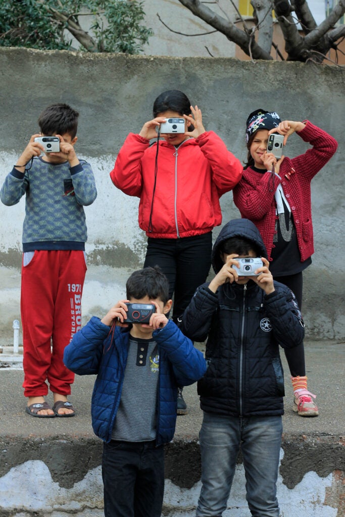 Students in the program shooting with film point and shoot cameras.