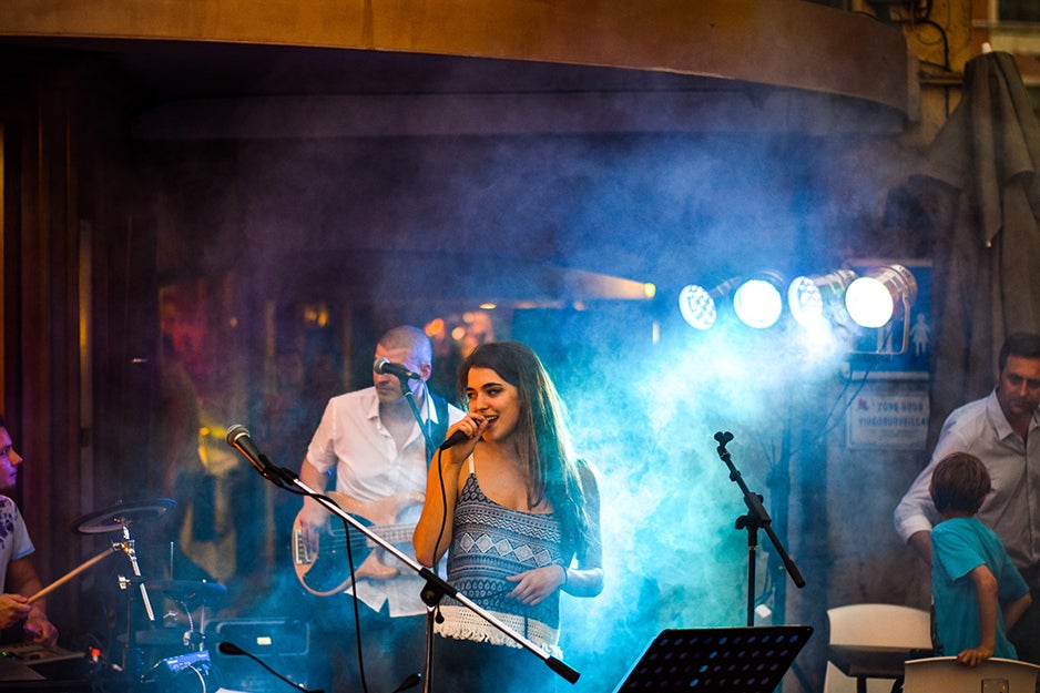 band playing with a fog machine