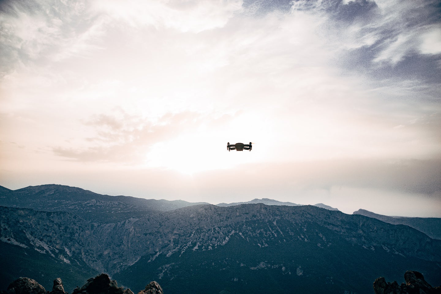 drone flying above the mountains in the sky