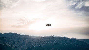 drone flying above the mountains in the sky