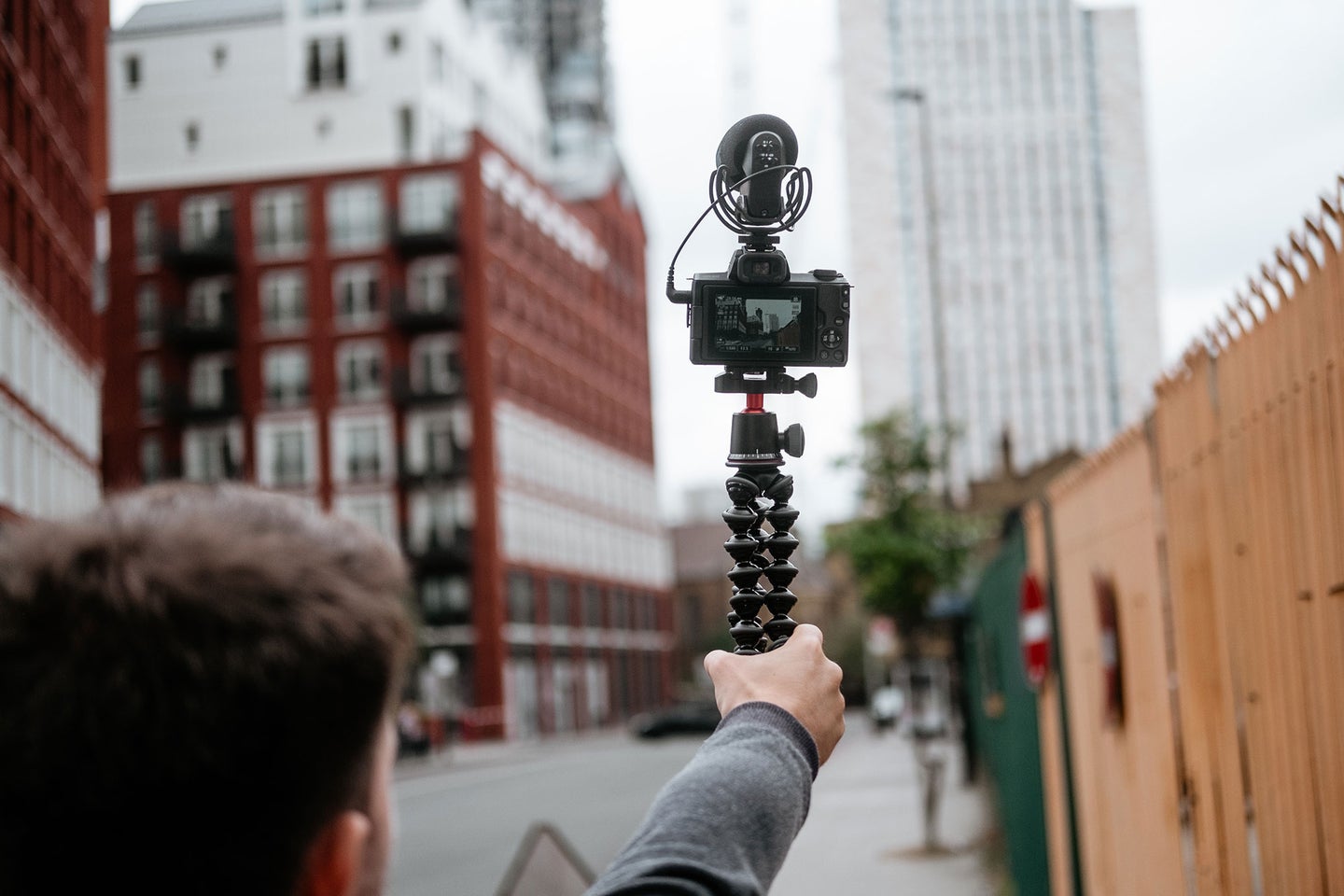Guy holding a tripod for selfie