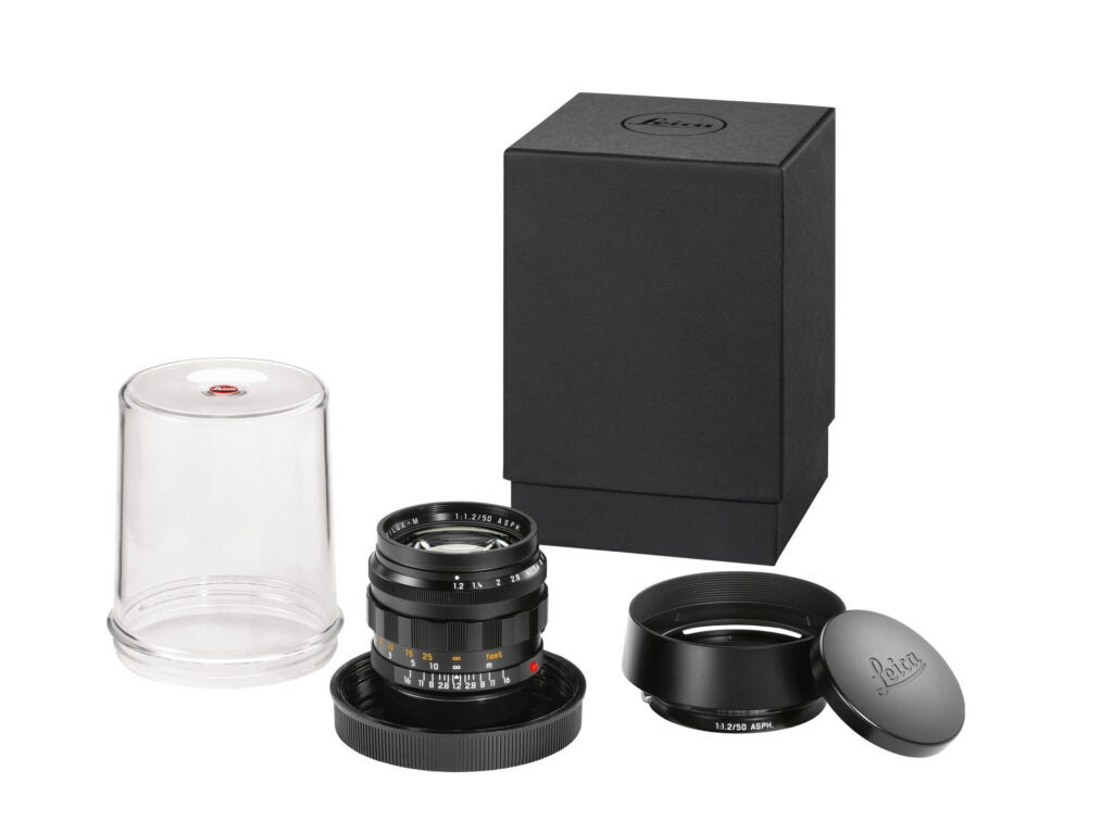 Leica Noctilux 50mm f/1.2 Classic lens with its accessories.