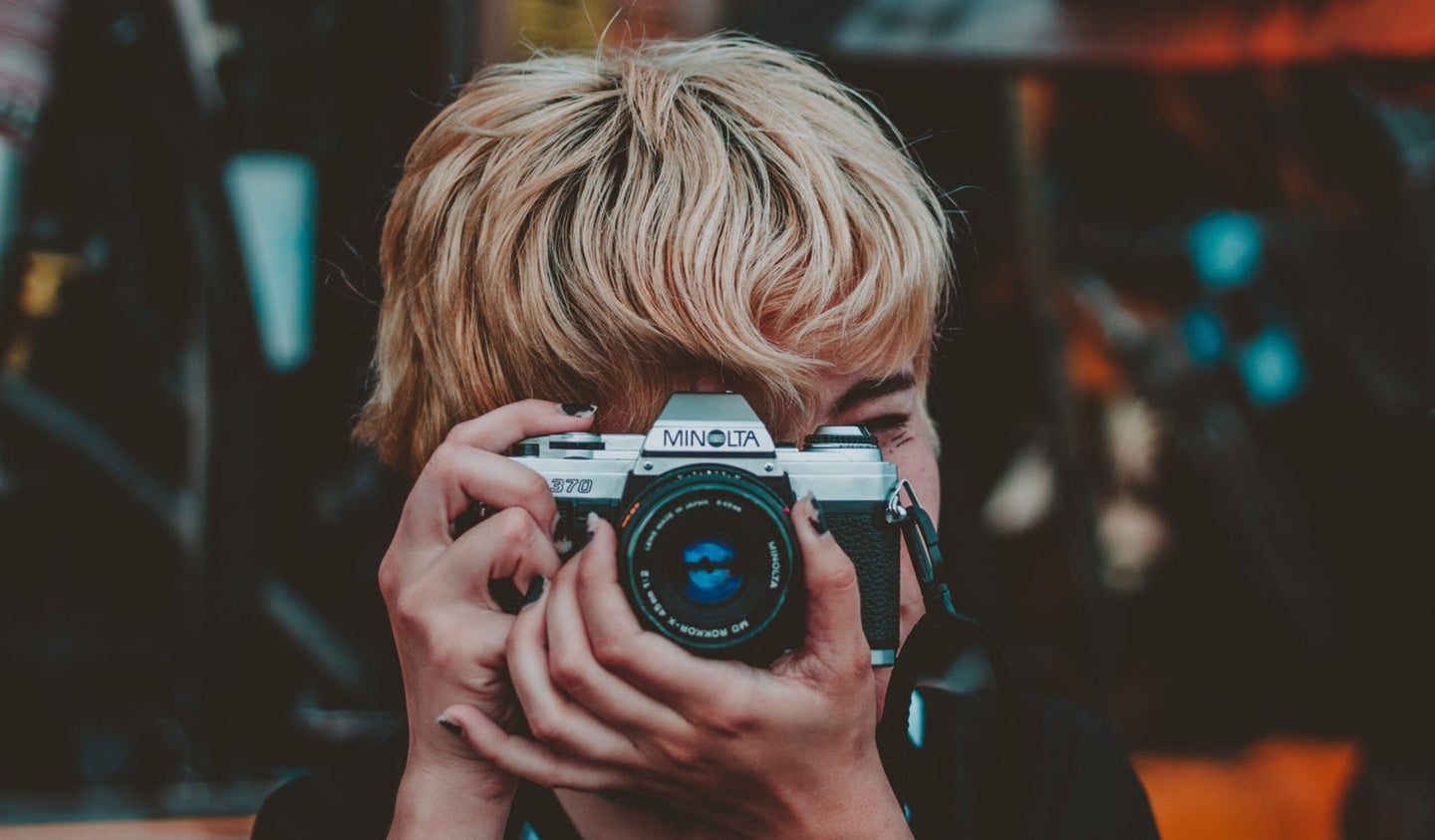 Person holding a film camera