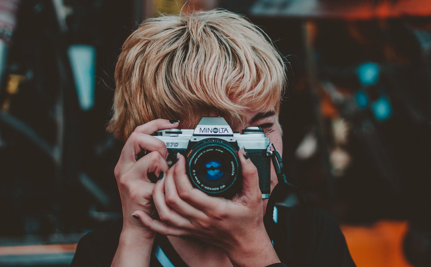 Person holding a film camera