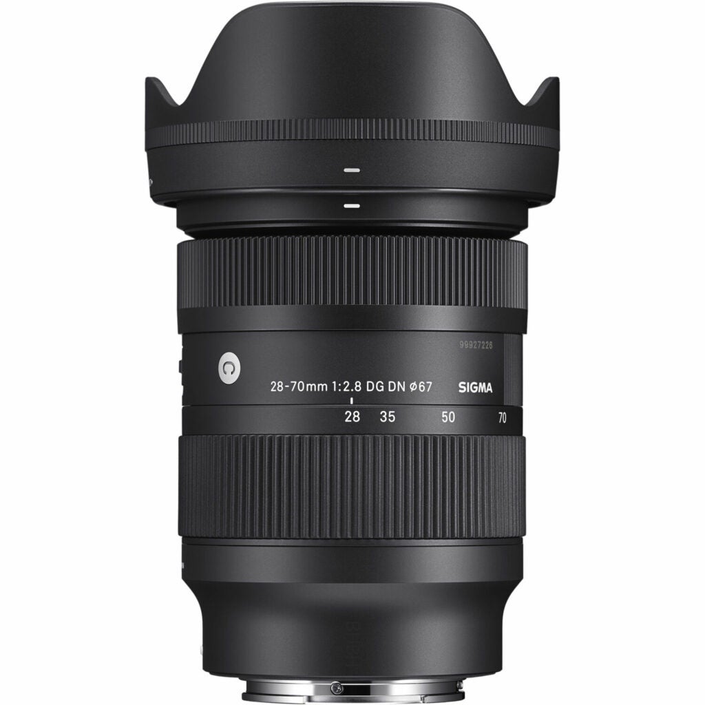 A Sigma 28-70mm Contemporary lens with its hood on a white background.