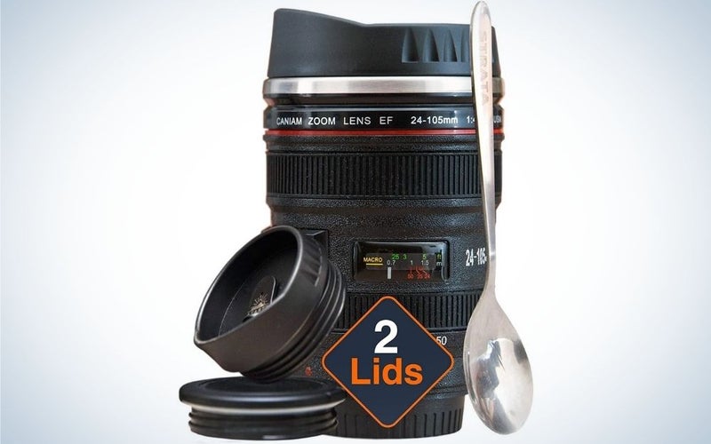 Camera Lens Coffee Cup written in front of it 2 Lids and a spoon in front of it.