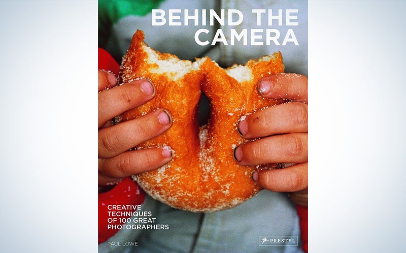 The cover of a photography book titled Behind the Camera: Creative Techniques of 100 Great Photographers