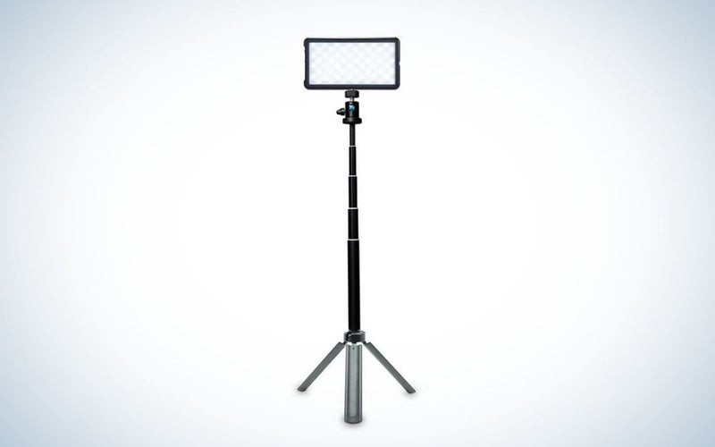 A broadcast lighting kit with a long holder stick with three legs as a support to ground.