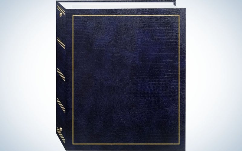 A square black book from the front with a golden font on it.