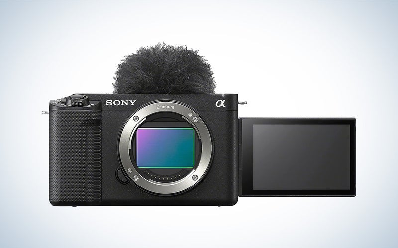 The Sony ZV-E1 mirrorless vlogging camera against a white background with a gray gradient.