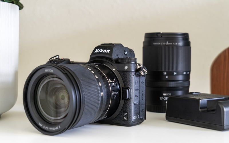 Nikon Z7 II mirrorless camera with lenses and battery charger.