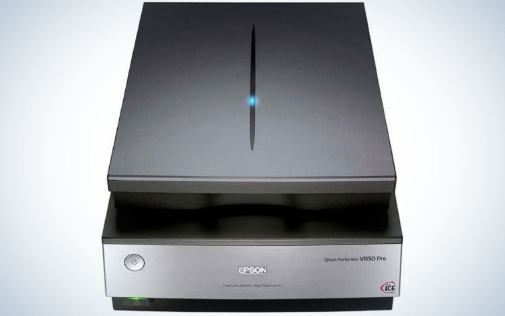 A black scanner with a blue dot on top, as well as a wide square shape with a gray front.