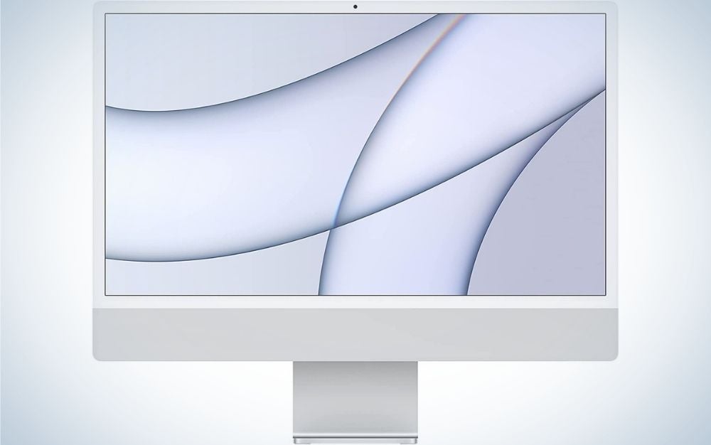 A white desktop with the Apple Mac mini brand mark.