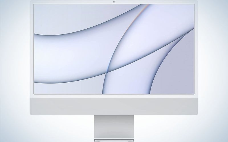 A white desktop with the Apple Mac mini brand mark.