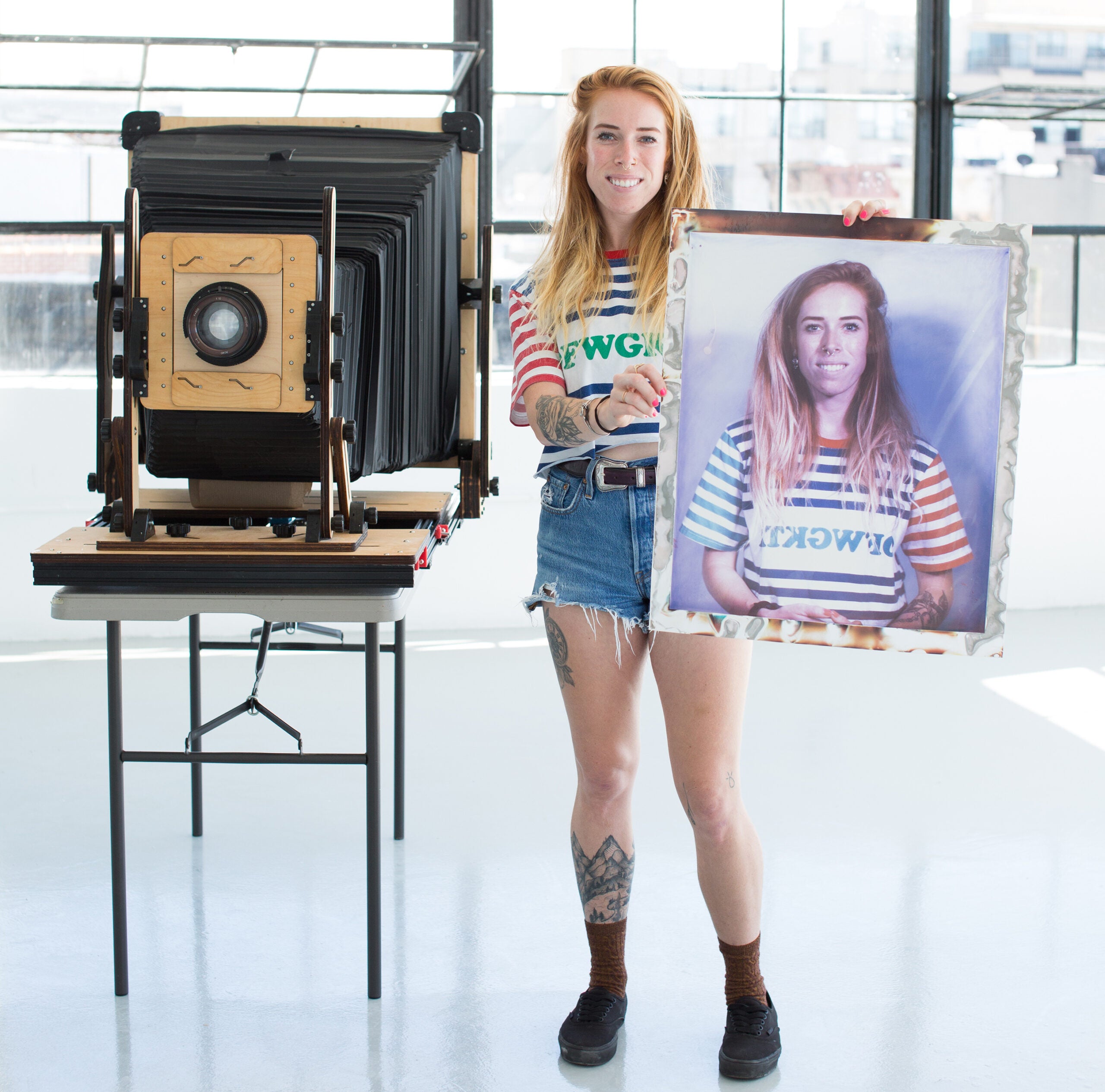 One of Ethan's portrait subjects holding a freshly made print.