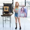 One of Ethan's portrait subjects holding a freshly made print.