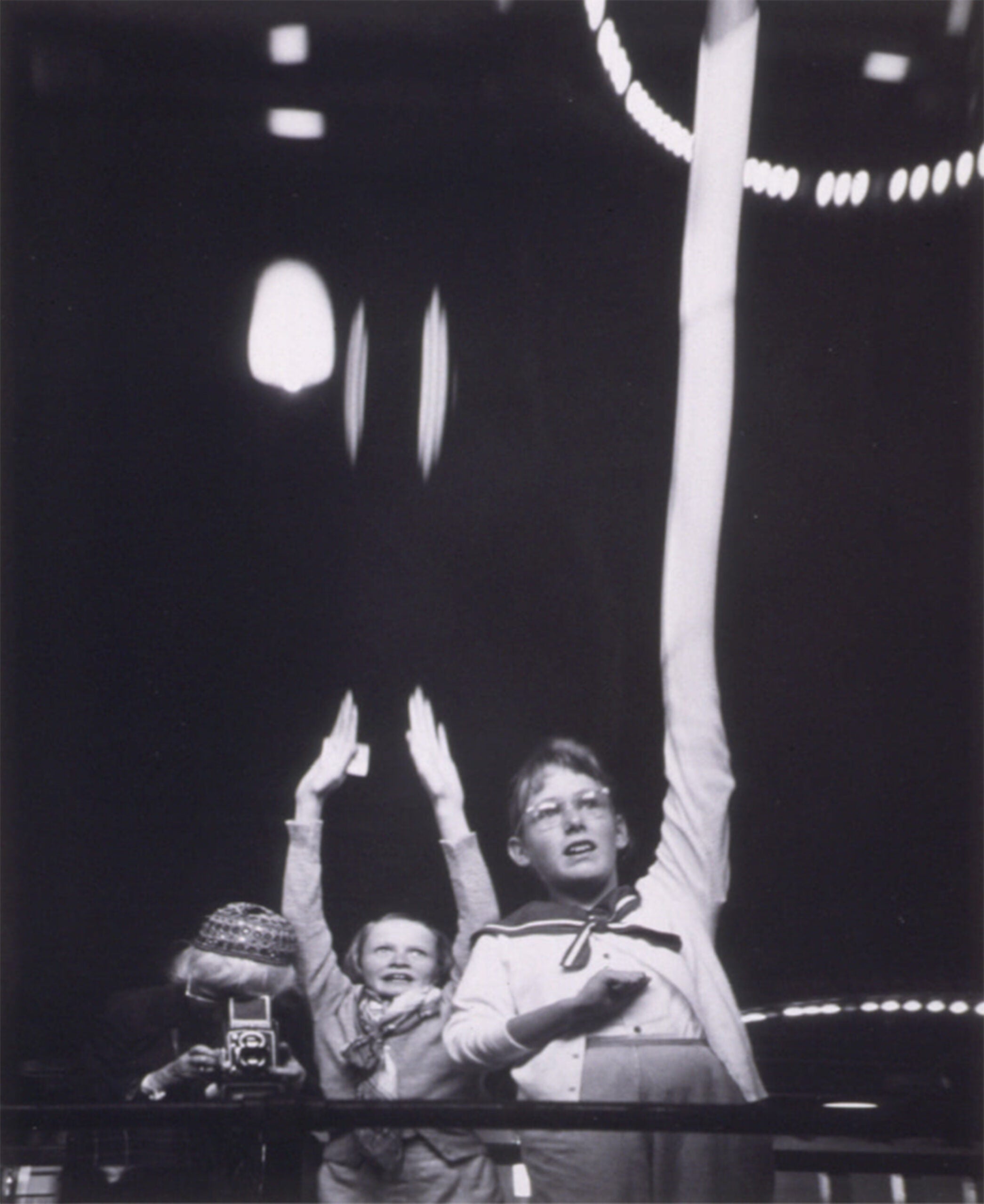 “Imogen Cunningham and Grandchildren at Fun House, San Francisco, 1955,” by Imogen Cunningham. Gelatin silver print, 8 3/4 x 7 1/8 inches. Gift of John H. Hauberg.