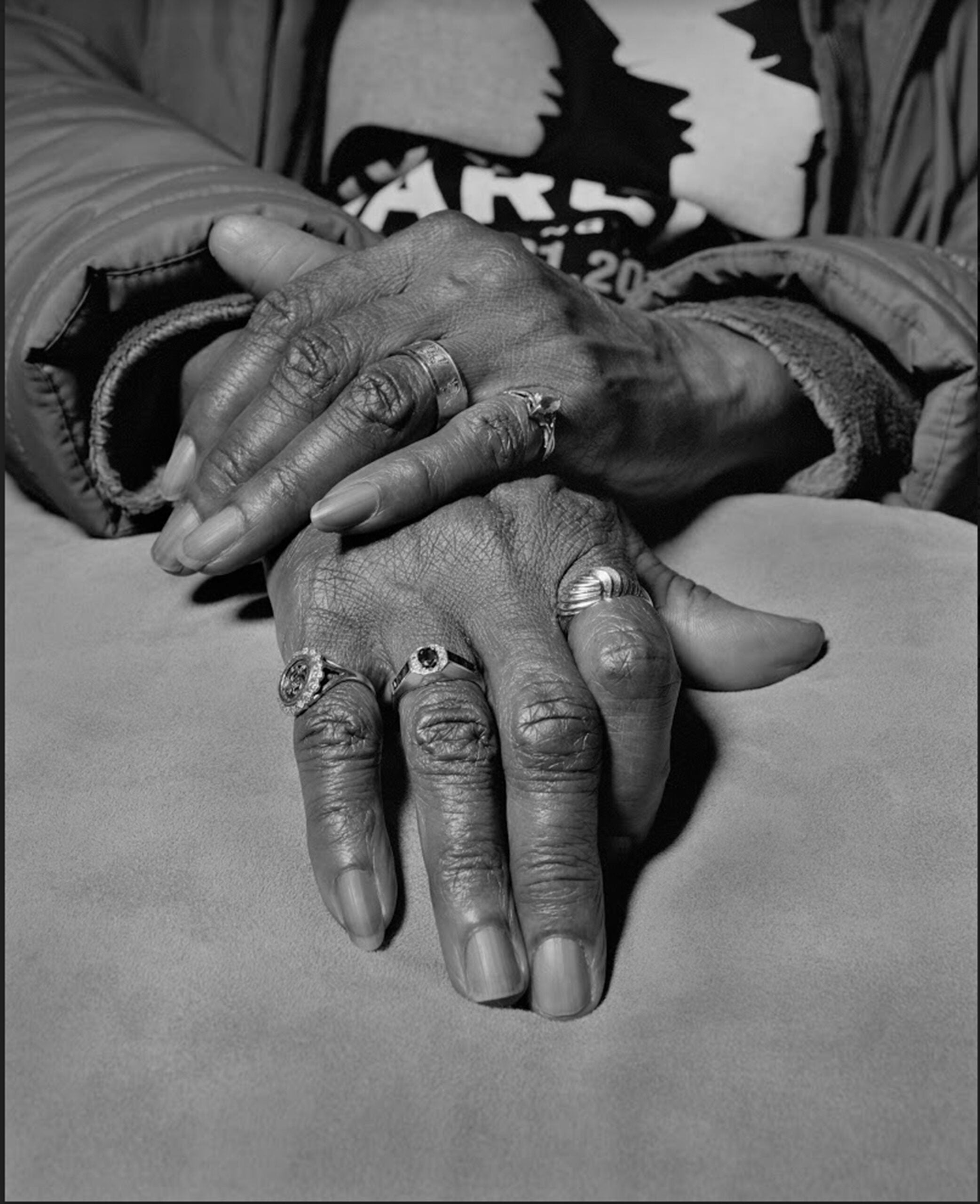 “Marilyn Moore, UAW Local 1112, Women’s Committee and Retiree Executive Board, with her General Motors company retirement gold ring on her index finger, Youngstown, Ohio, 2019” by LaToya Ruby Frazier. Gelatin silver print, 60 x 48 inches.