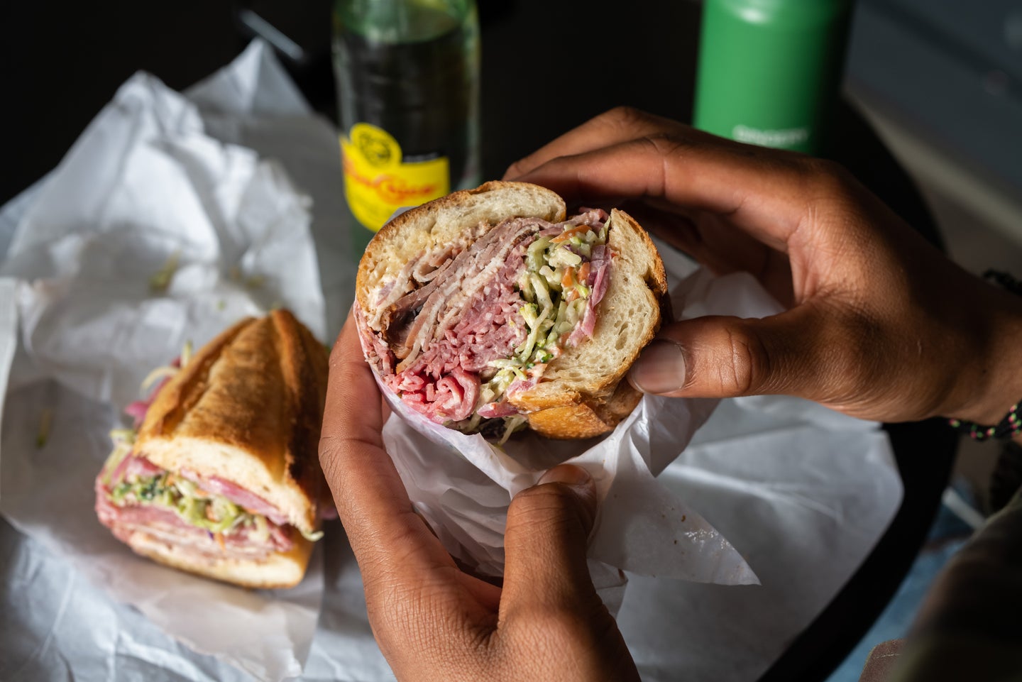 sandwich in hands food photography tips