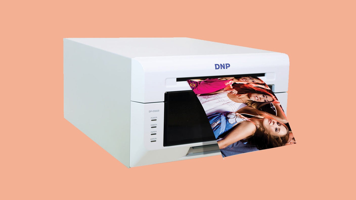 DNP dye sub printer making a print on a peach background