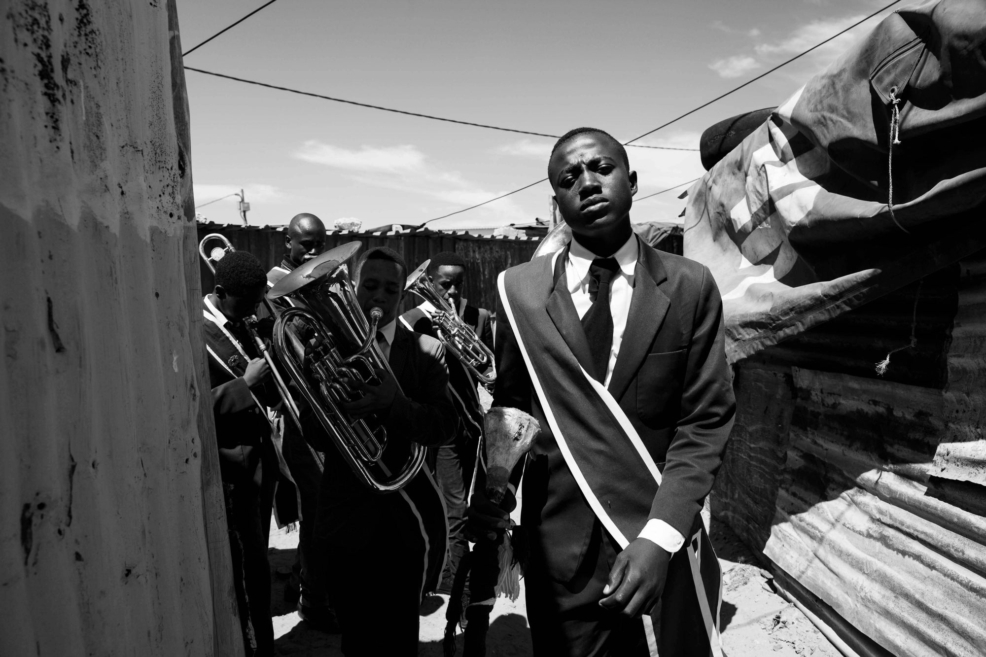 Siyabulela, 16, leads his churchÃs brass band through the KTC neighborhood of Nyanga in Cape Town, South Africa.